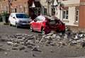 Car crushed by falling debris from block of flats