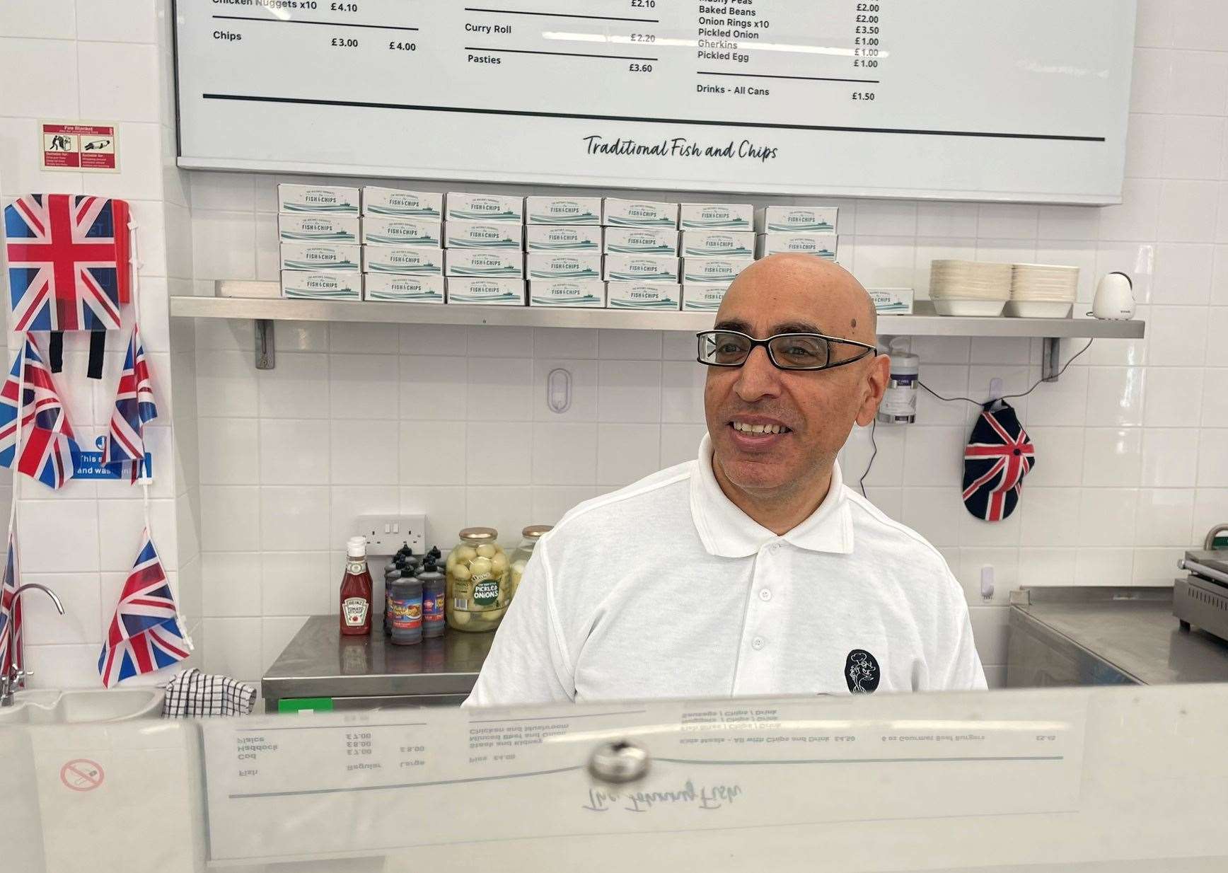 Daljit Bining behind the counter of the Johnny Fish, Sheerness