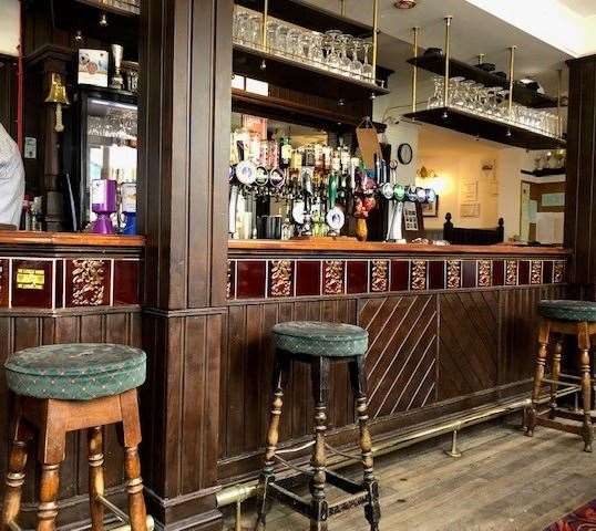 The traditional looking bar, lined with stools, was marshalled expertly by a barman on top of his game