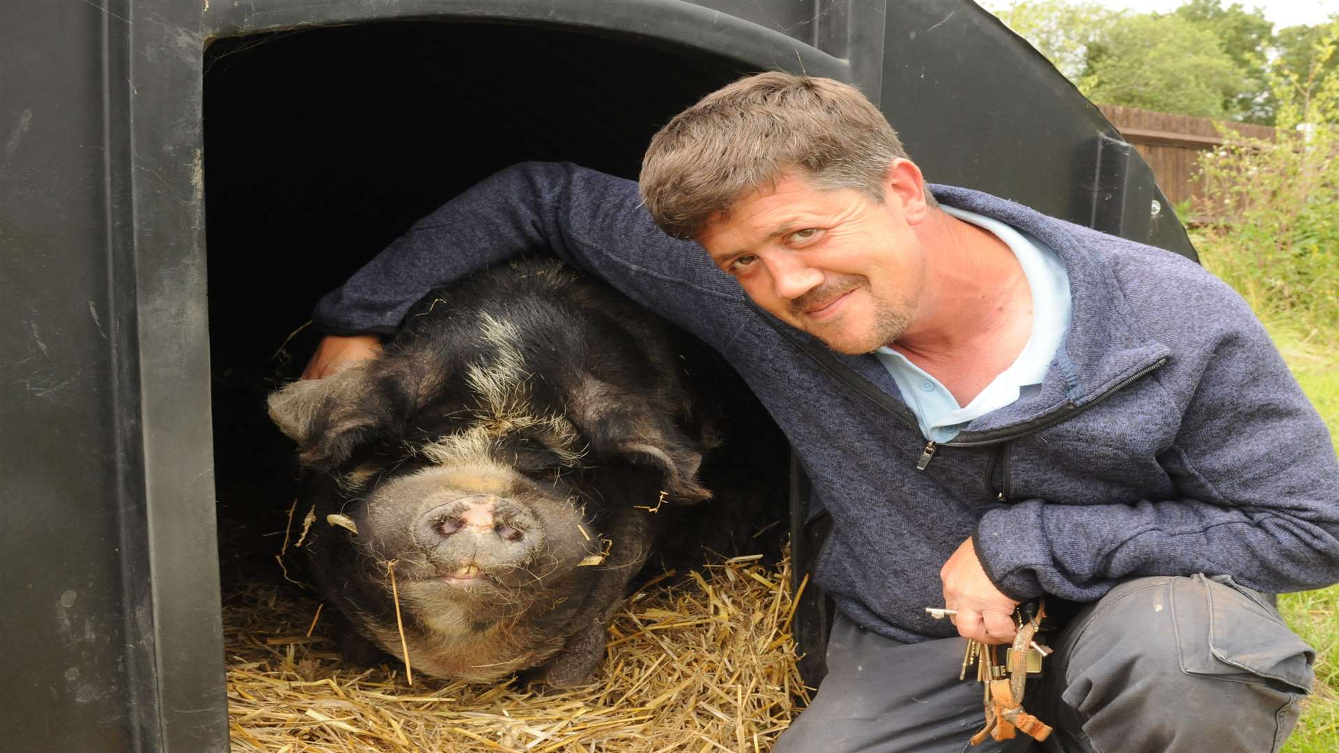 Andy Cowell with Spice the kune kune pig. Picture: Steve Crispe