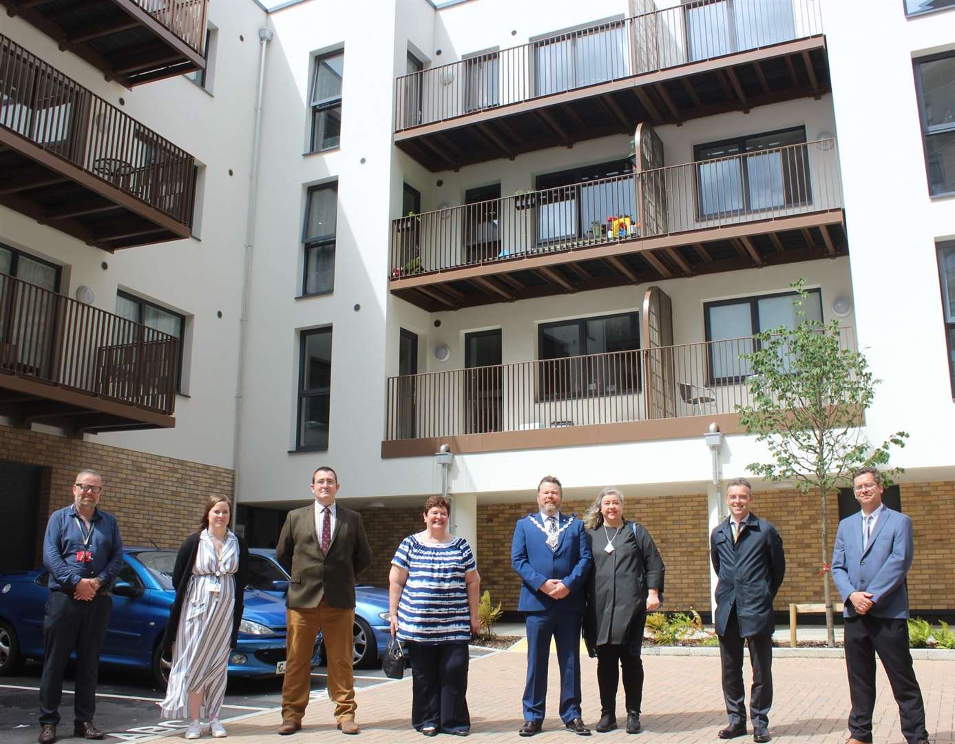 Mayor of Ashford Cllr Callum Knowles joins Cllr Bill Barrett (far right), Sharon Williams (fourth left) and other officers outside the town centre development