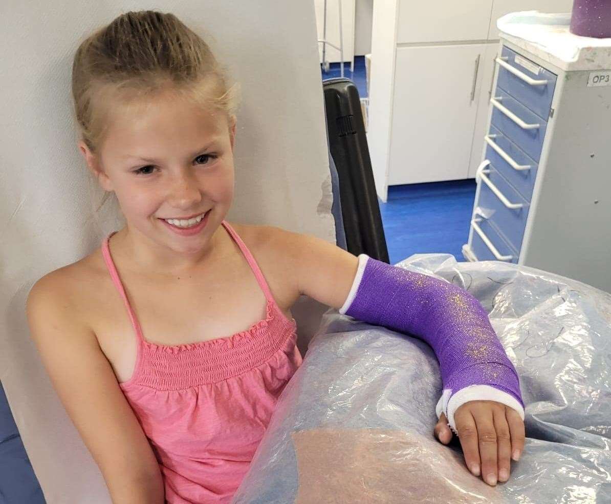 Tamzin Everett, 10, in hospital with her left arm in a plaster cast two weeks after breaking it on a slide in Beachfields sandpit, Sheerness