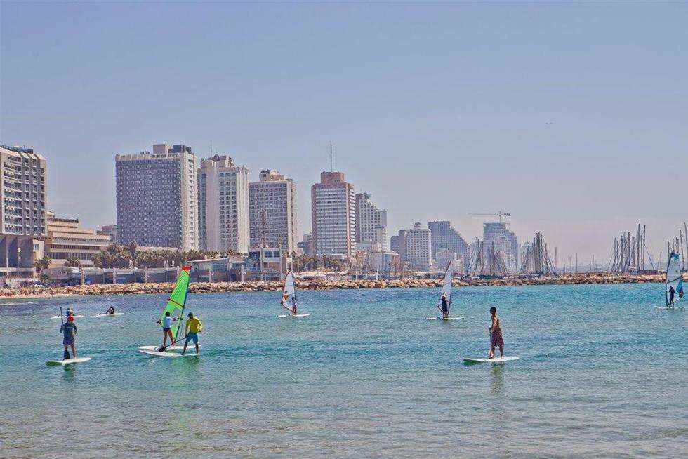 Tel Aviv's skyscrapers overlook its sandy beaches and blue sea