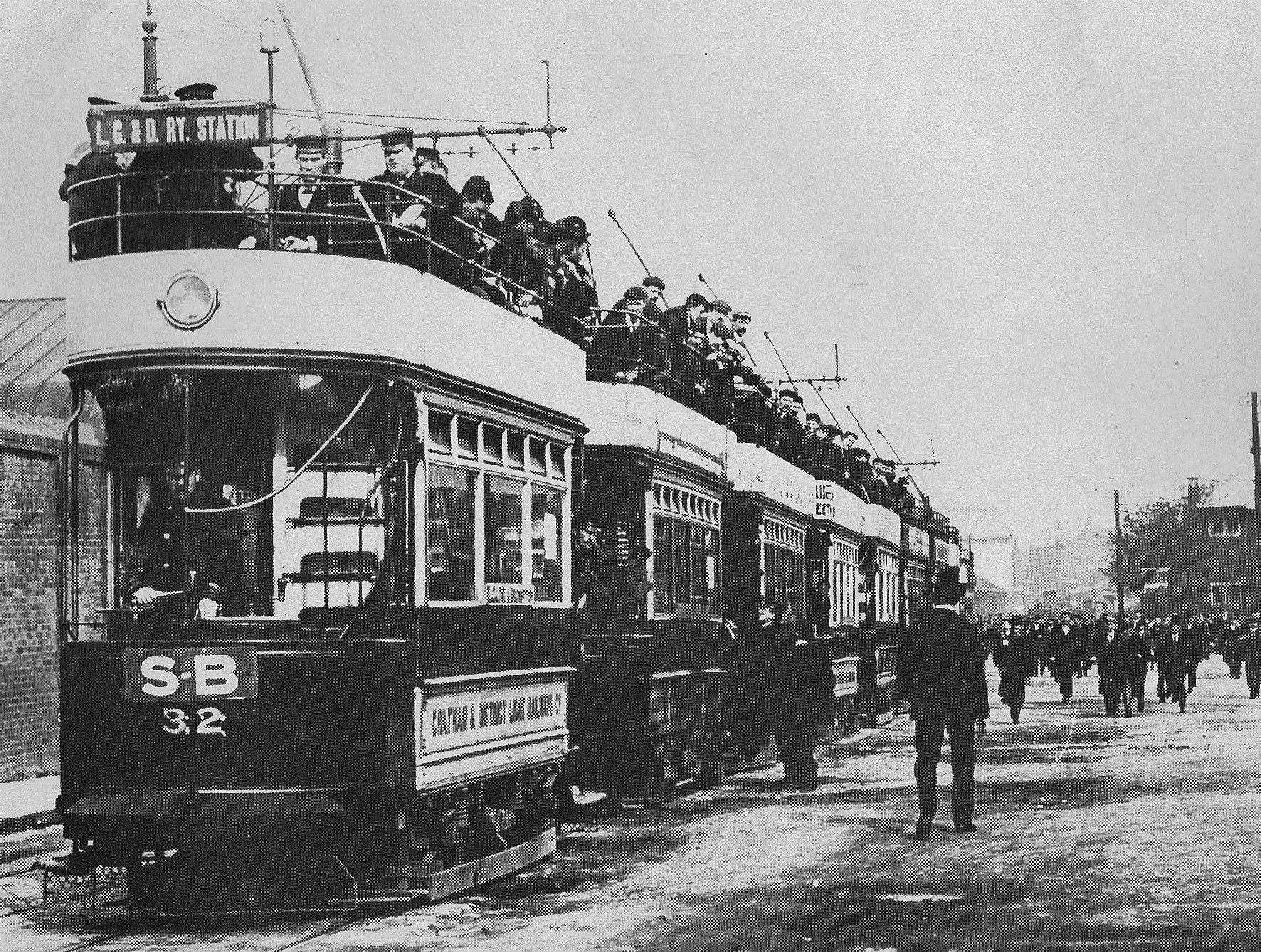 Chatham trams outside the dockyard loaded with workers and Navy personnel
