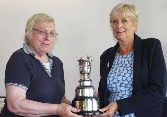 Pauline Paciorek, left, of Hythe Imperial, receives the Cecil Leitch 5 Club women's trophy from Lesley Johnson, ladies' captain at Canterbury Golf Club