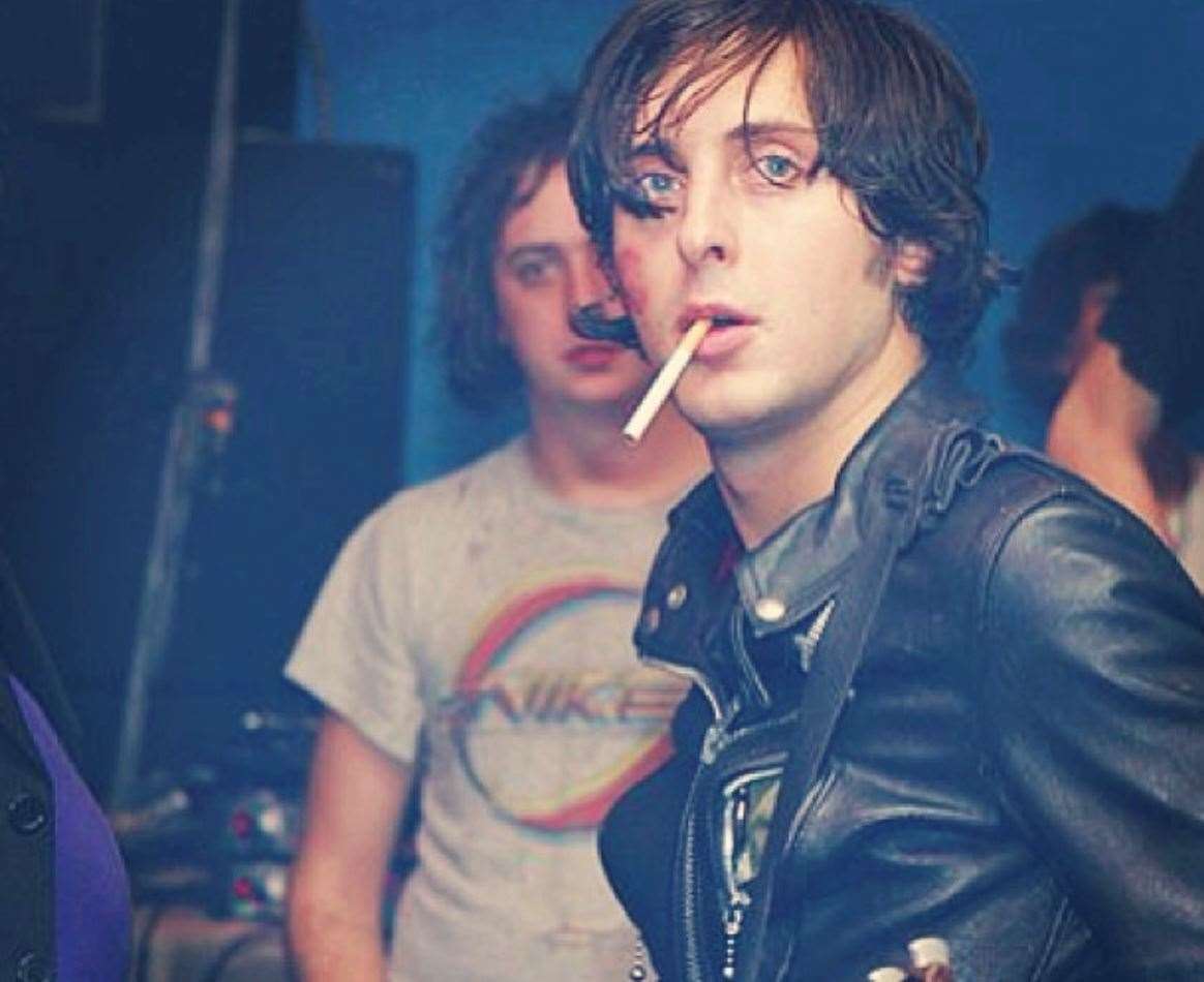 Carl Barât of The Libertines, with Dean Fragile - organiser of The Libertines' Tap 'n' Tin gig - in the background