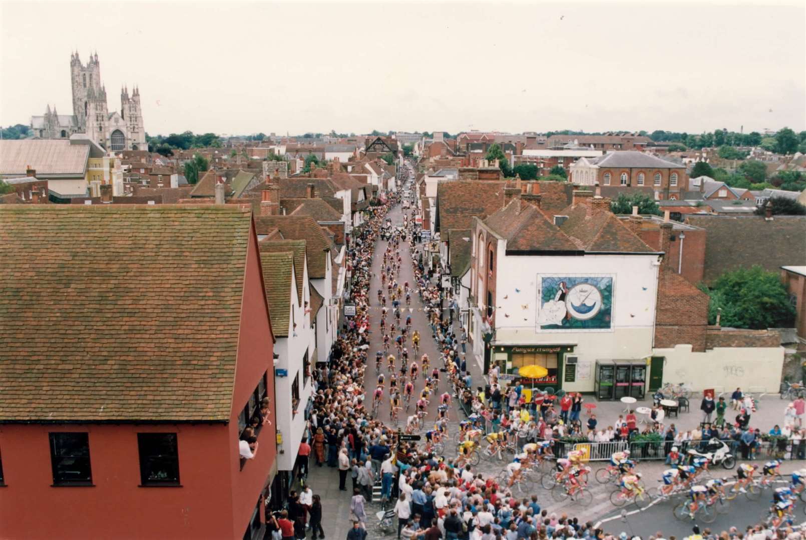 For the first time in its history, the Tour De France came to Kent in 1994. Stage four of the world's biggest sporting event saw riders set off in Dover and end in Brighton. Here, the riders are pictured cycling through Canterbury's city centre... picture taken from Westgate Towers