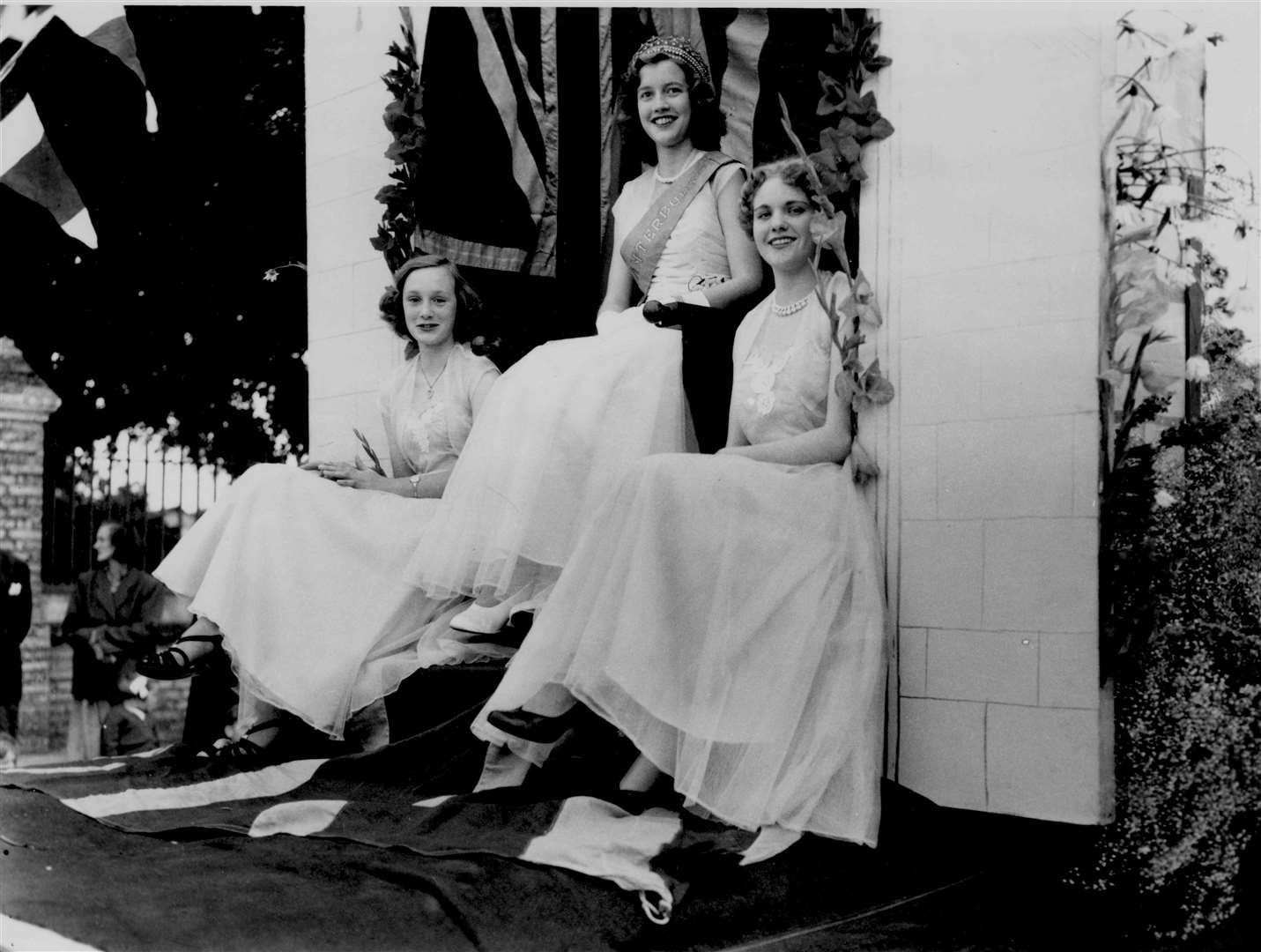 Miss Canterbury Pauline Groombridge on her carnival float with Maids of Honour Barbara Farrow, 16 and Shirley Mears, 16 - August 1954