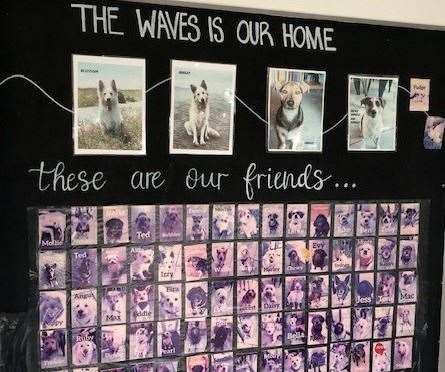 I was still adding up the number of dogs present, and rapidly running out of fingers, when I spotted this useful photo wall chart.