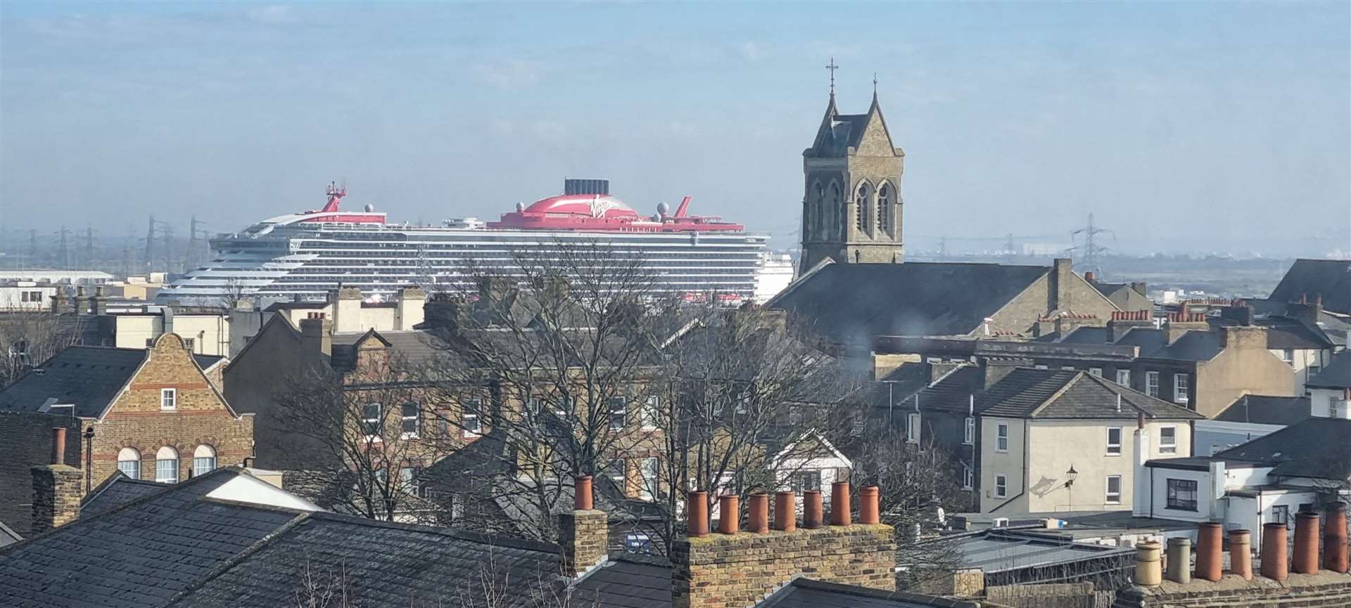 The Valiant Lady, Virgin's latest cruise ship, dwarfs the skyline of Gravesend