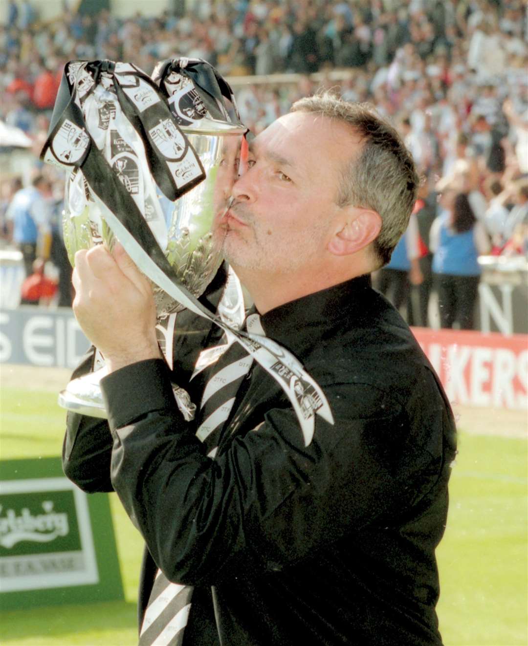 Tommy Sampson gets his hands on the FA Vase in 2000 - Deal are the only Kent winners. Picture: Paul Dennis