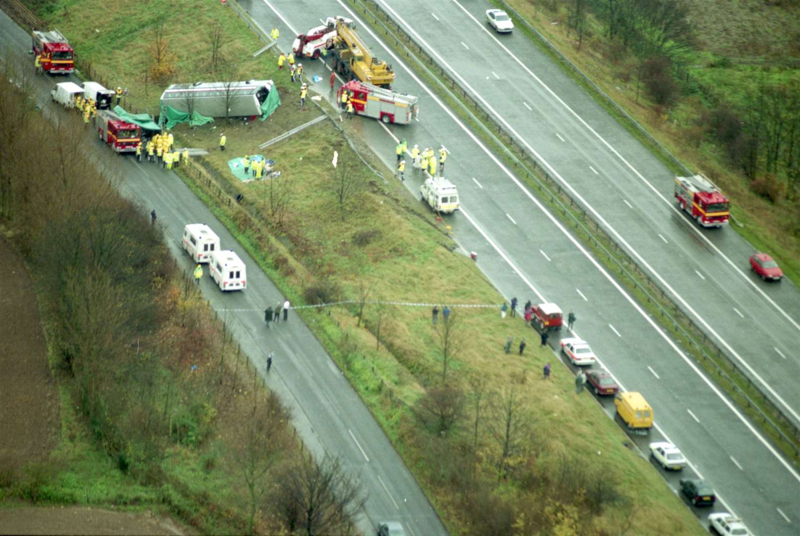 Ten people were killed and 34 injured in a tragic coach crash on the M2 in 1993. Tragedy struck on November 10 at 9.40am when the coach hit a van and careered off the slick road surface and down an embankment at Ospringe, near Faversham, landing on its side. It was carrying a group of tourists on their way to Canterbury Cathedral. Nine American tourists and the driver were killed.
