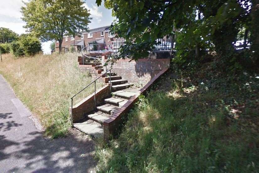The victim was walking up this track when he was approached by a knife-wielding man