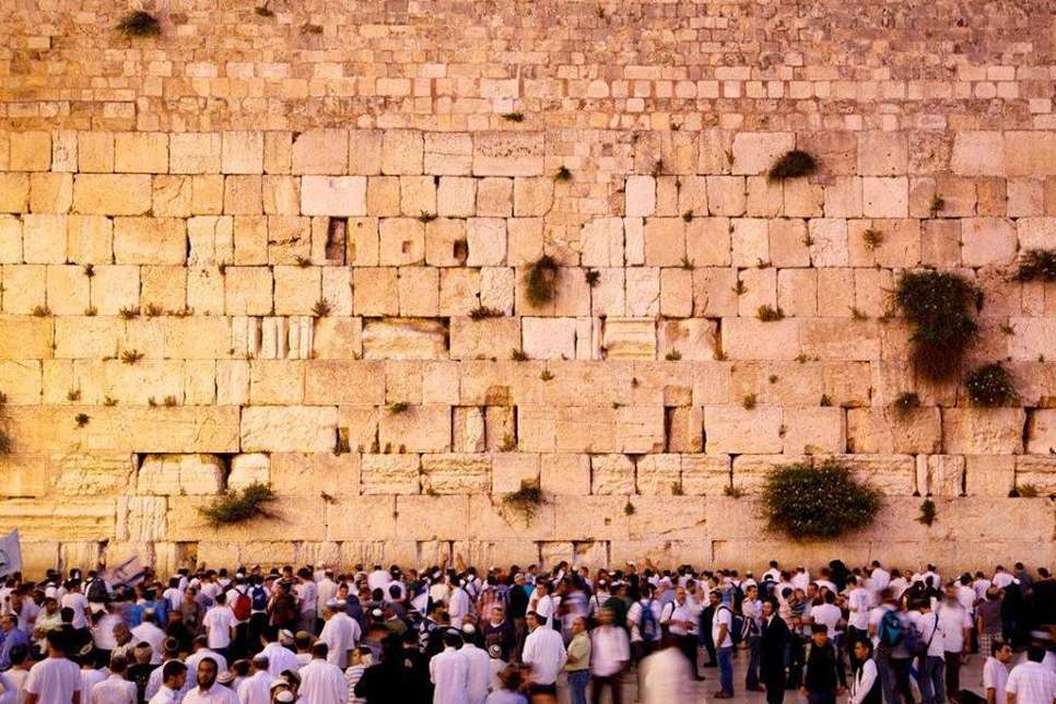 A crowd praying at the Wailing Wall