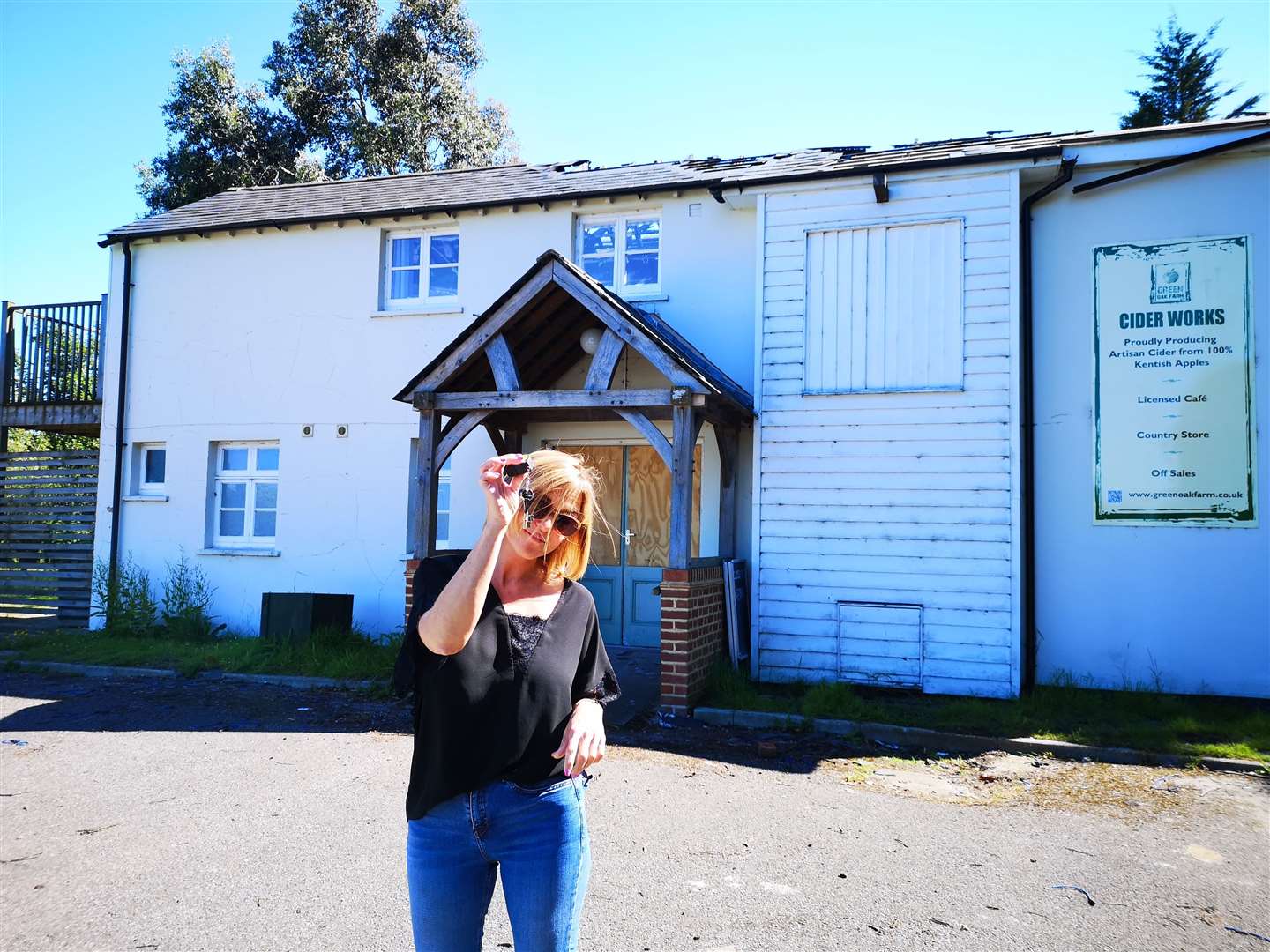 Jodie South getting the keys to the wrecked building in 2019