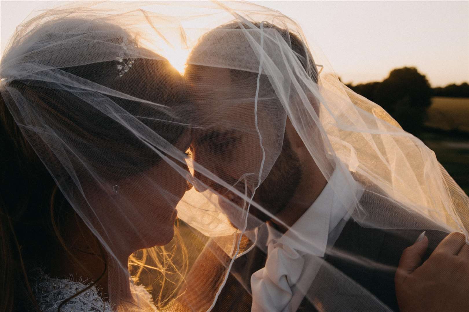 Together forever, Holly and Stan share a moment under the veil