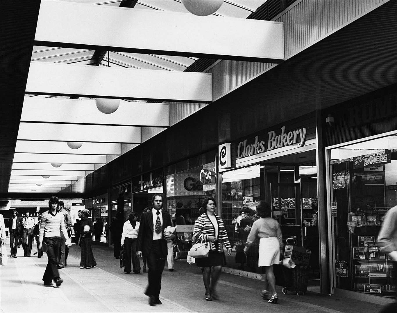 Flares, bell bottoms and kipper ties were all the rage in this 1975 shot in the early days of the Tufton shopping centre. Picture: Steve Salter