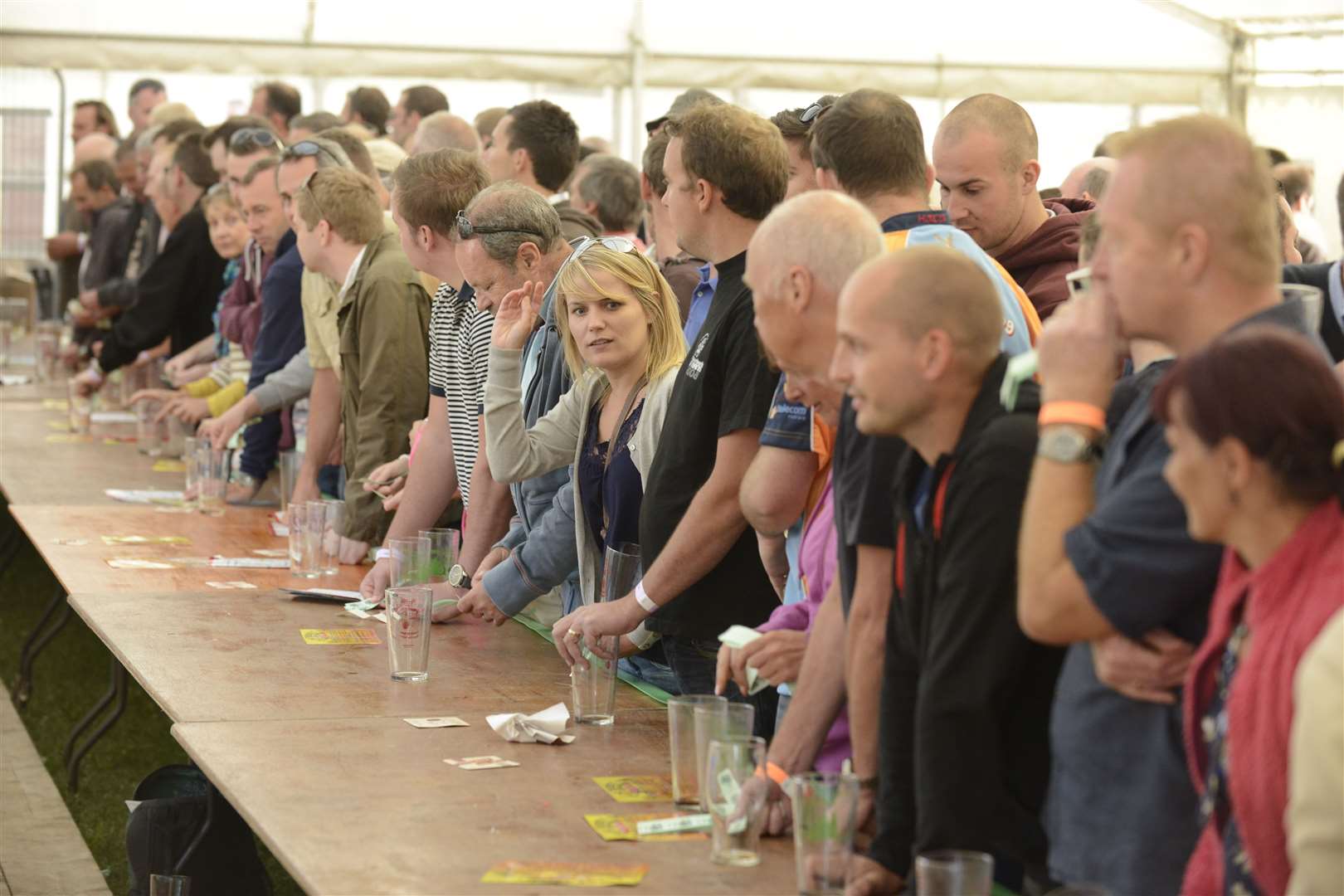 Thirsty punters wait for a drink at East Malling Beer and Cider festival, 2013. Picture by: Martin Apps