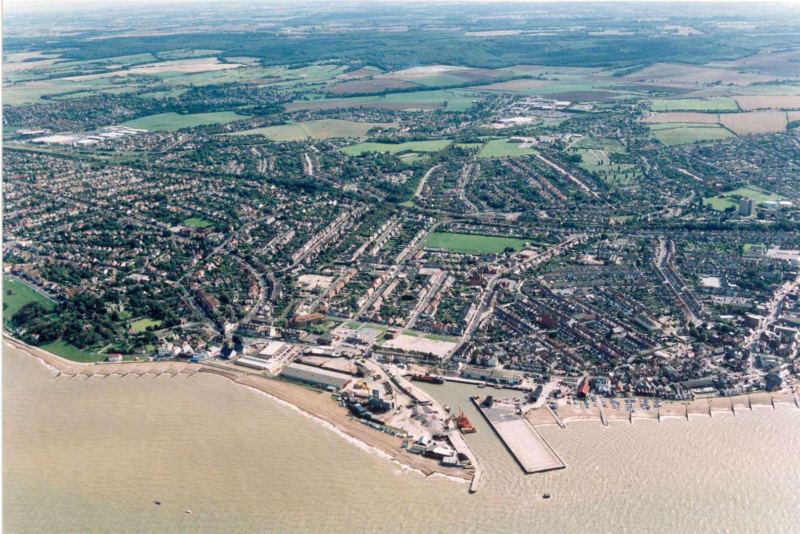 Whitstable Harbour and the town, with the beginning of Tankerton Slopes on the left, pictured in 1995