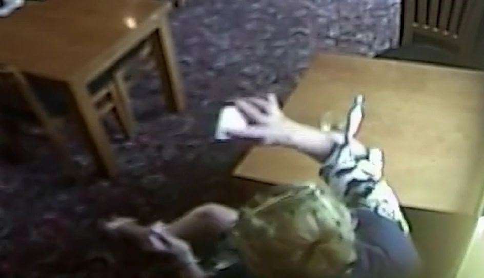 CCTV showed the moment Stephanie Langley smashed a phone on a table in the Hare and Hounds
