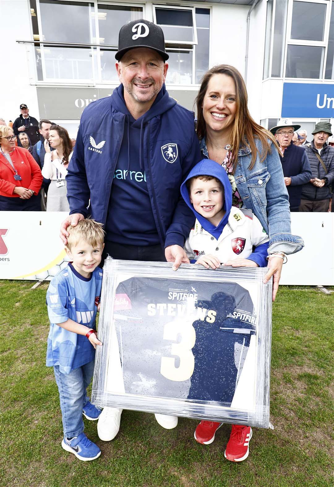 Darren Stevens with his now-retired number three shirt alongside children Flynn and Leo and wife Katie. Picture: Max Flego Photography