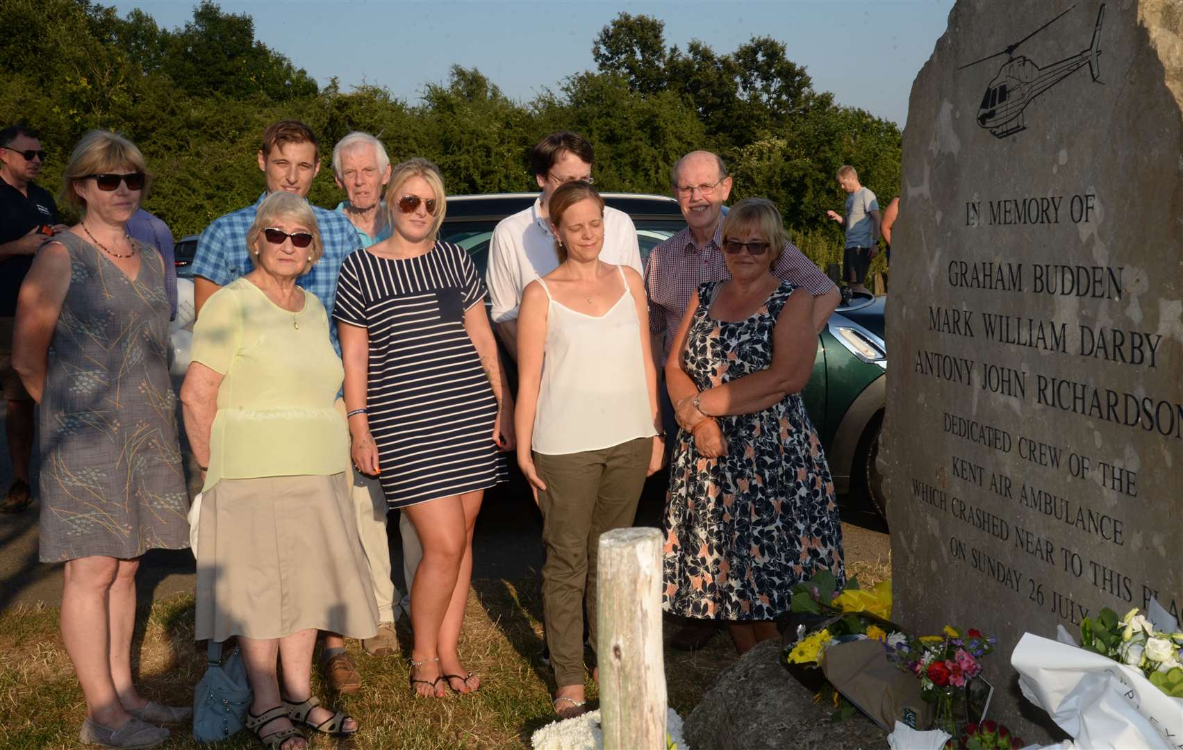 The families of the air ambulance crew who died in a crash 25 years ago at their memorial at Bluebell Hill back in 2018. Picture: Chris Davey.