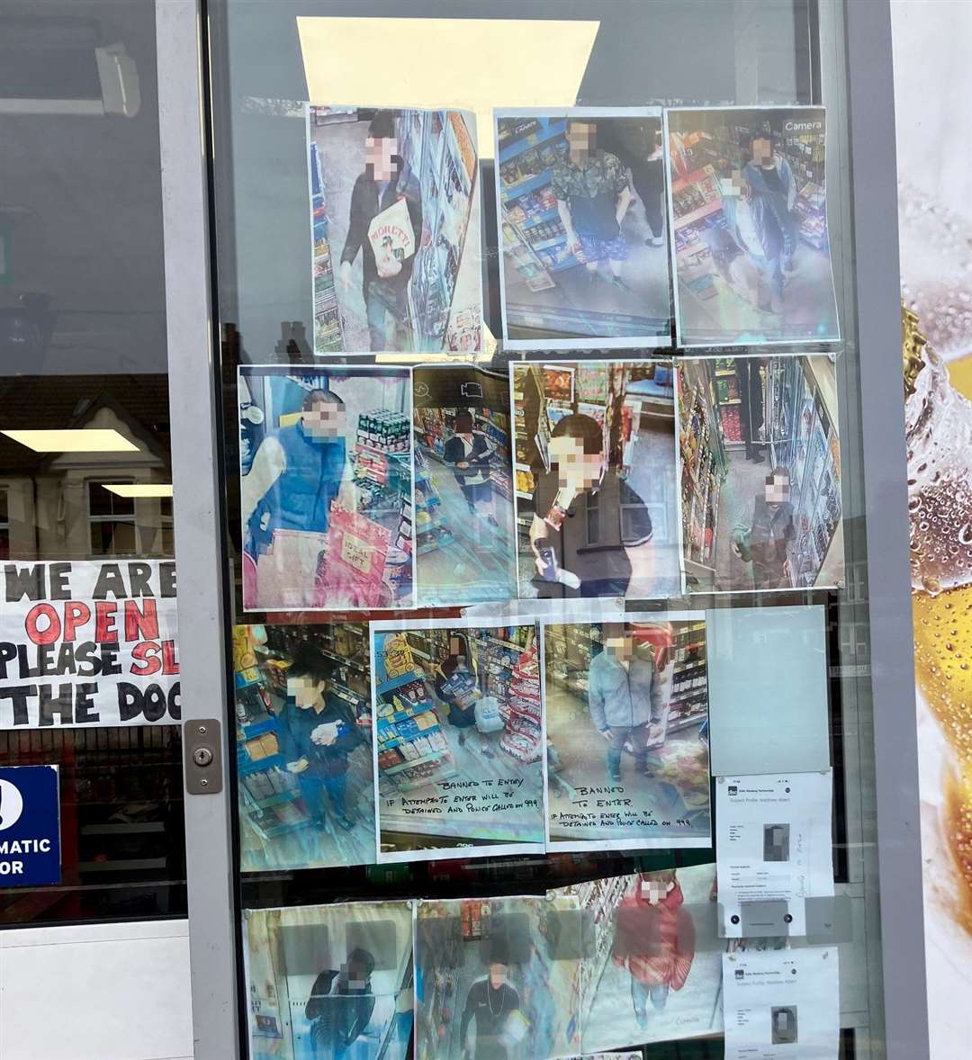 Images in the window of One Stop in Watling Street, Chatham show those banned from the shop for suspected shoplifting