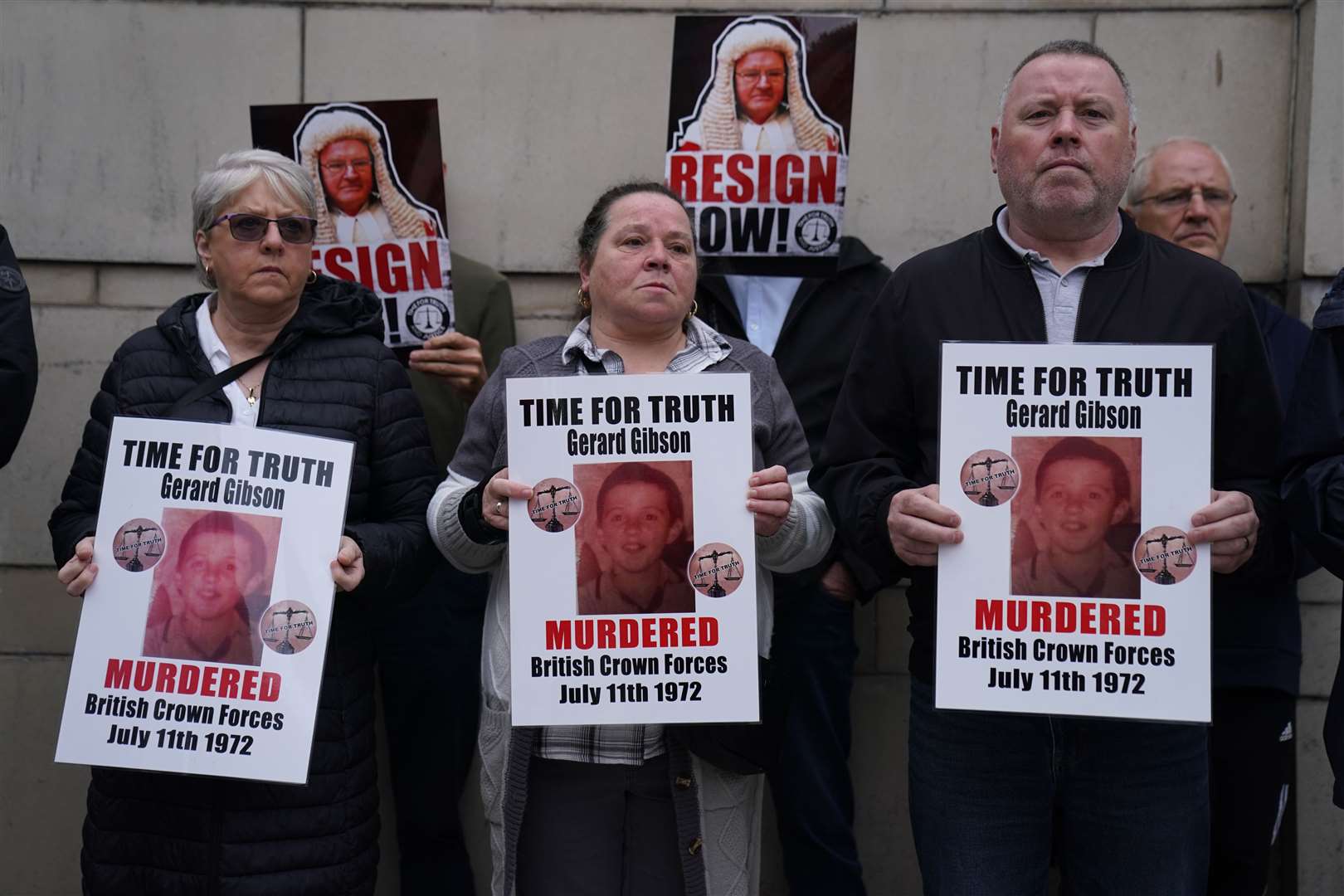 Family members of Troubles victims and their supporters protesting the Legacy Act outside the Court of Appeal at the Royal Courts of Justice in Belfast (Brian Lawless/PA)