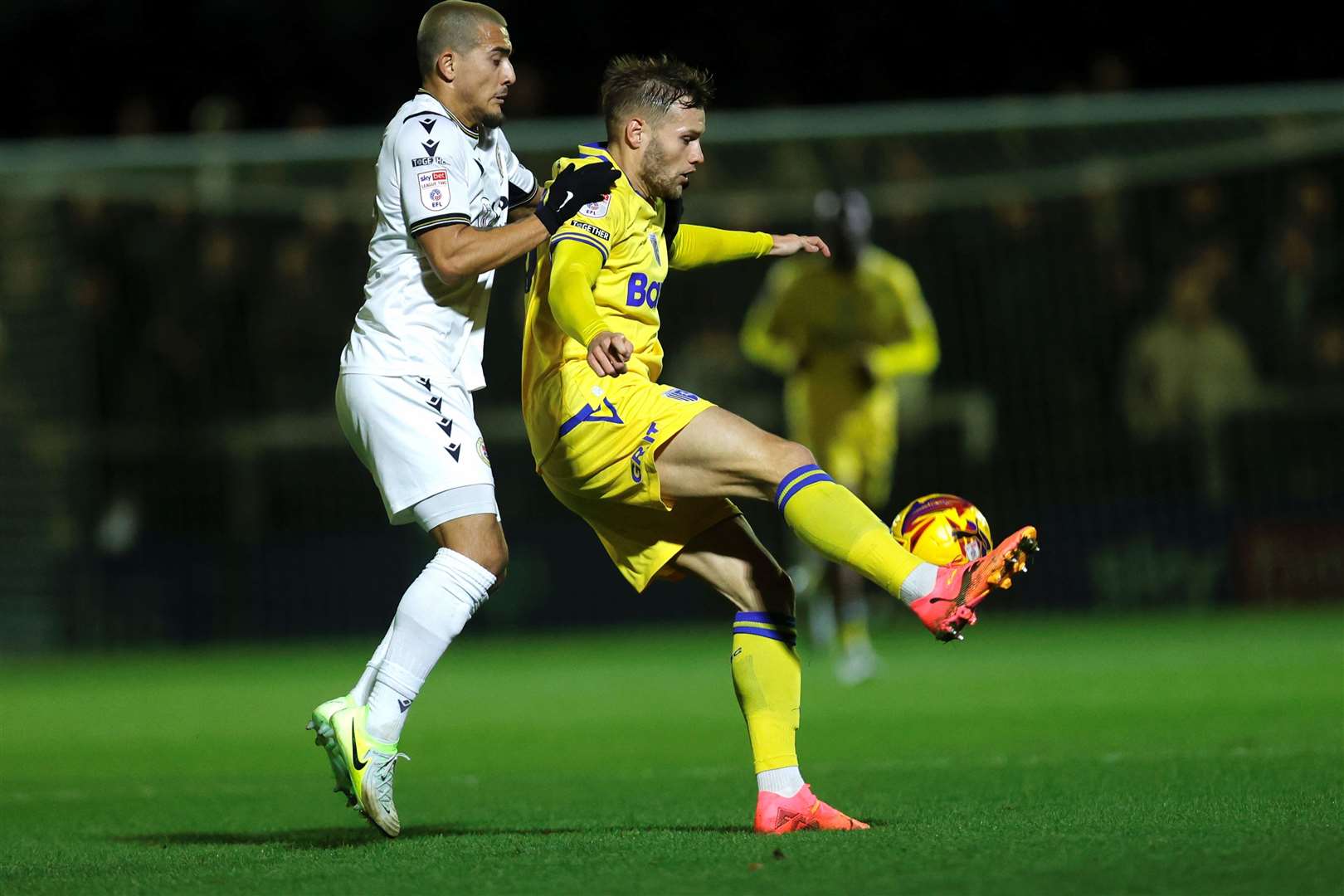 Gillingham striker Elliott Nevitt fends off Omar Showunmi Picture: @Julian_KPI