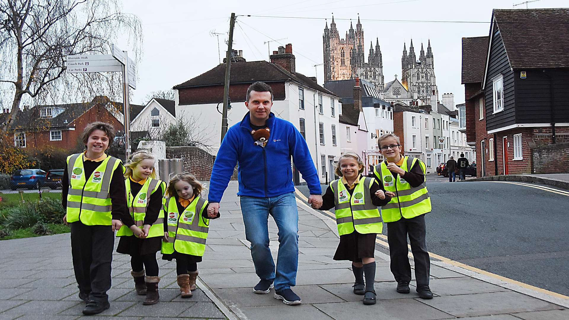 Phil Gallagher (CBeebies' Mister Maker) with KM Charity Team mascot Ted the bear and children from Blean Primary School at the Marlowe Theatre, Canterbury.