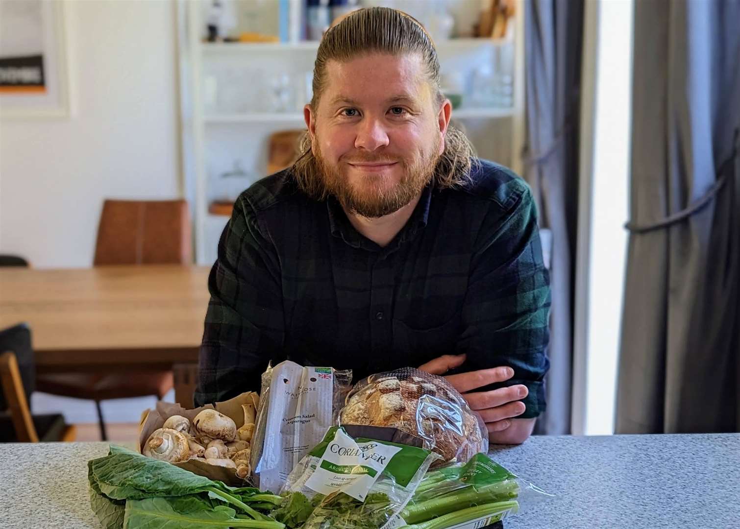 Rhys Griffiths at home with the produce he saved from landfill on his visit to Folkestone Community Fridge