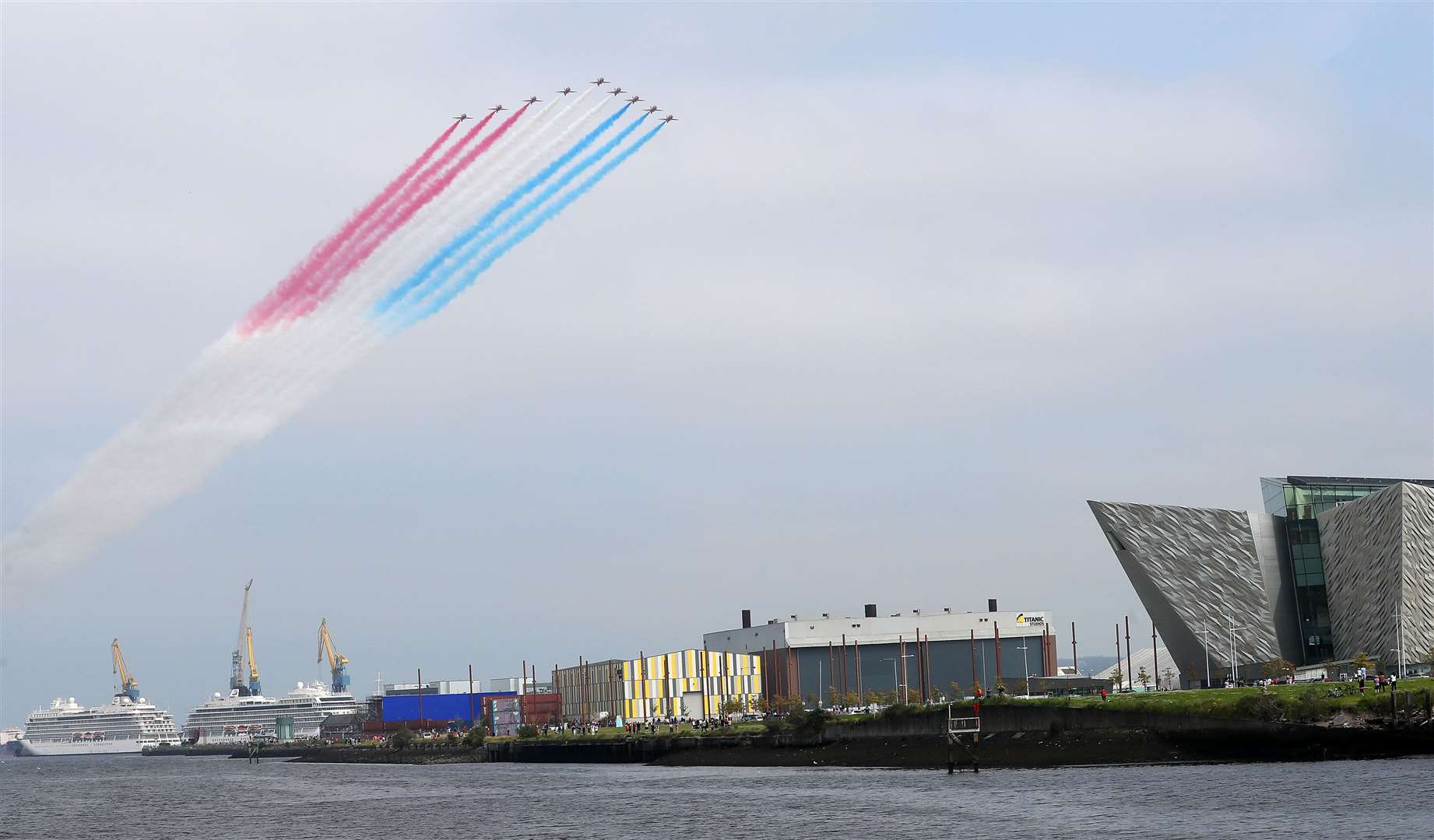 The Red Arrows fly over the Titanic slipway (Brian Lawless/PA)