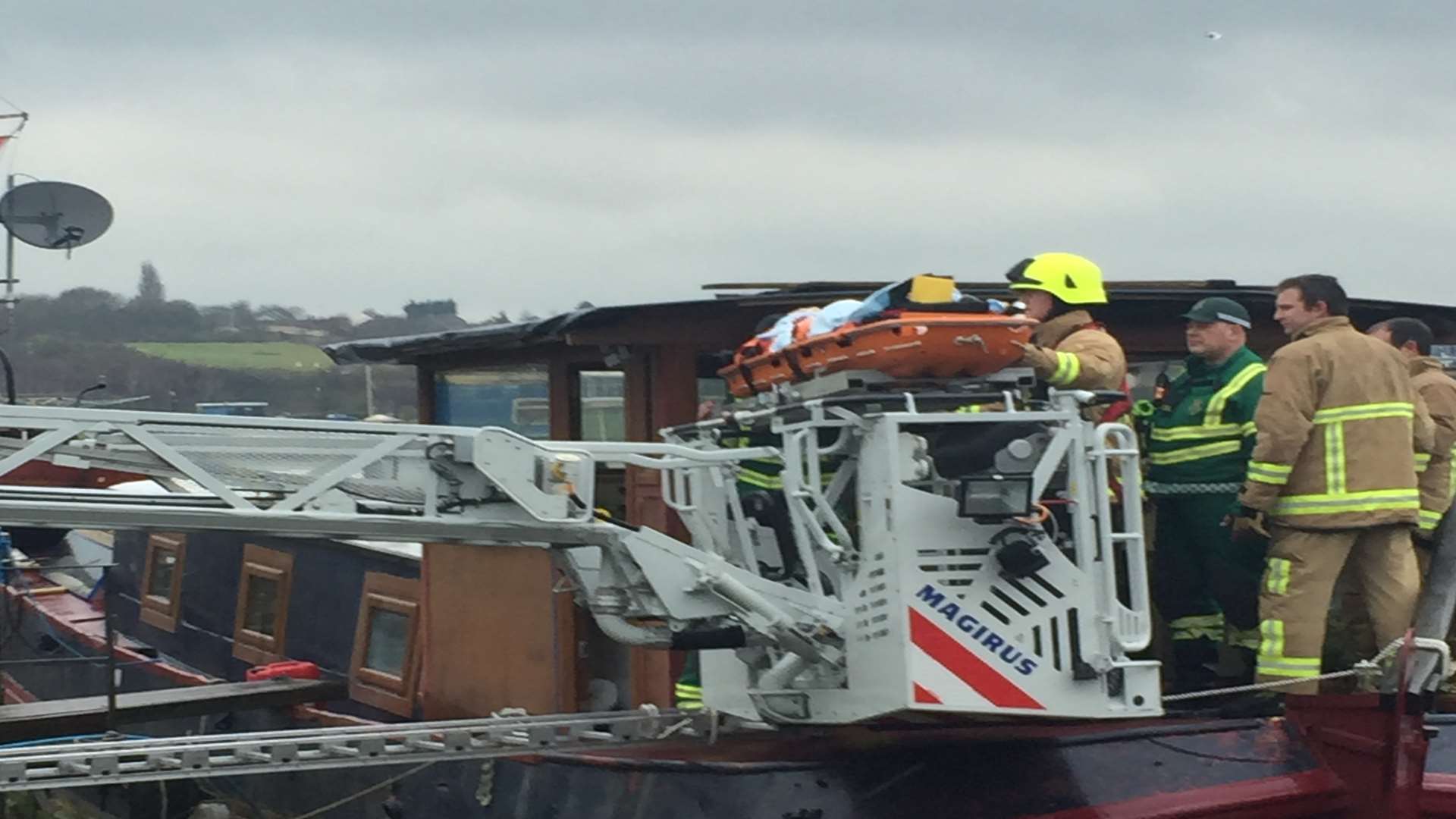 Emergency services helping a woman thought to have broken her leg at Medway Bridge Marina, Borstal