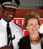 Ch Const Michael Fuller and Ann Barnes inserted ceremonial bolts into the building