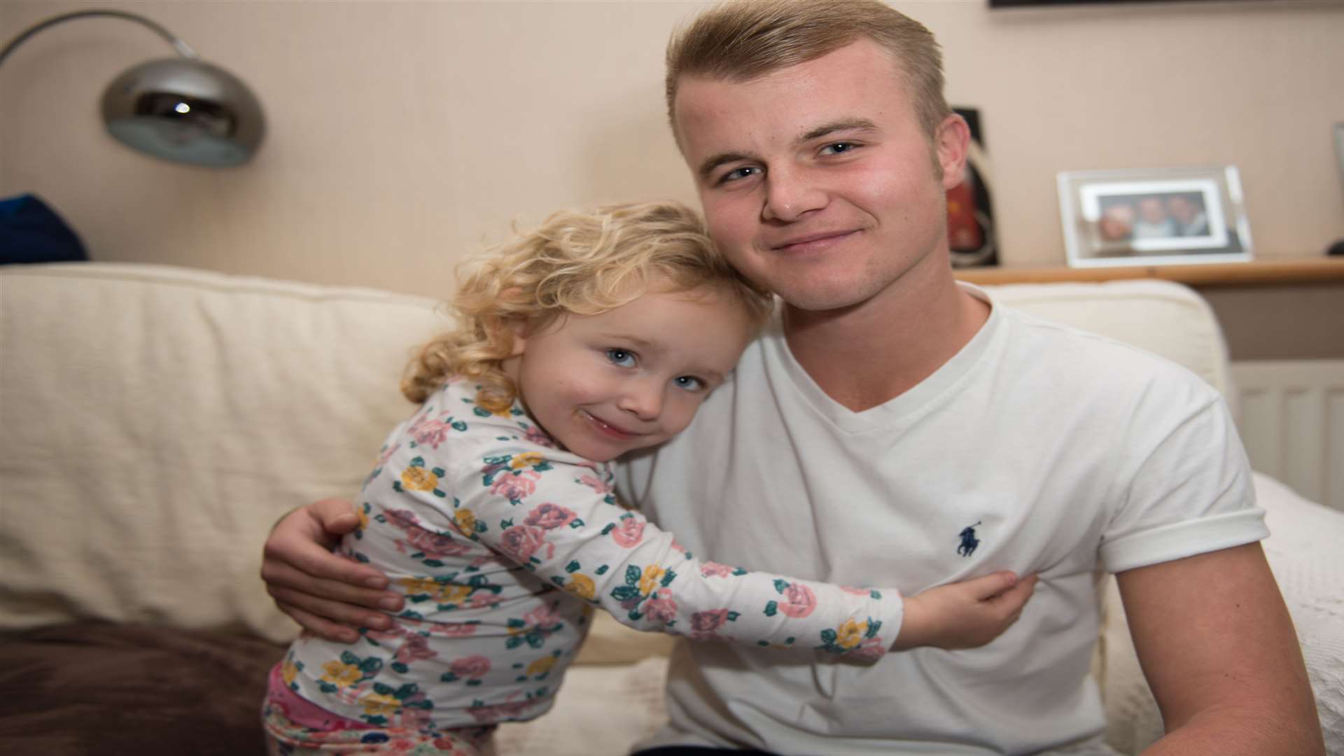 Lilly-Rae Hackett gives Conor Clark a big hug after he saved her from getting burnt at a firework display. Picture: Roger Charles