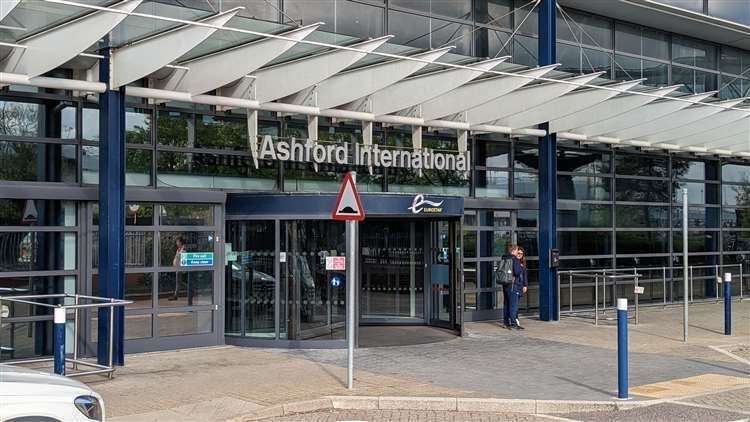 A woman has been arrested after allegedly assaulting two officers on a train in Ashford