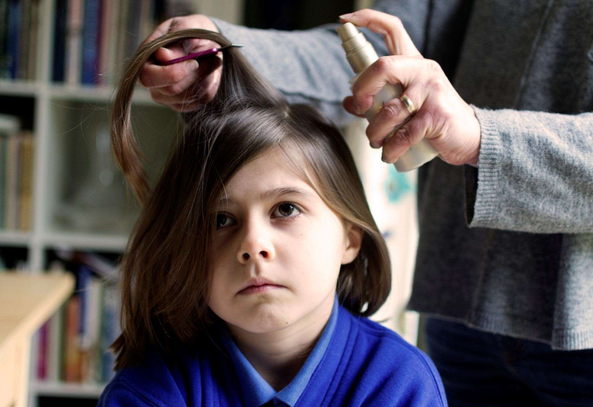 The NHS advises families with head lice to comb regularly with conditioner and a fine-toothed comb. Image: iStock.