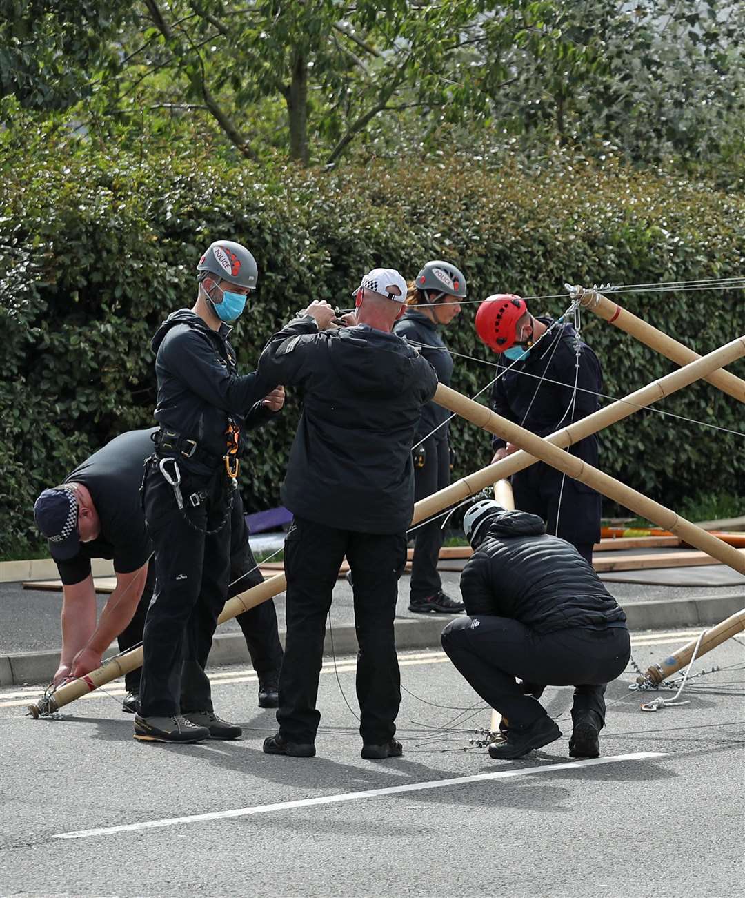 Police and emergency services dismantle the bamboo lock-ons (Yui Mok/PA)