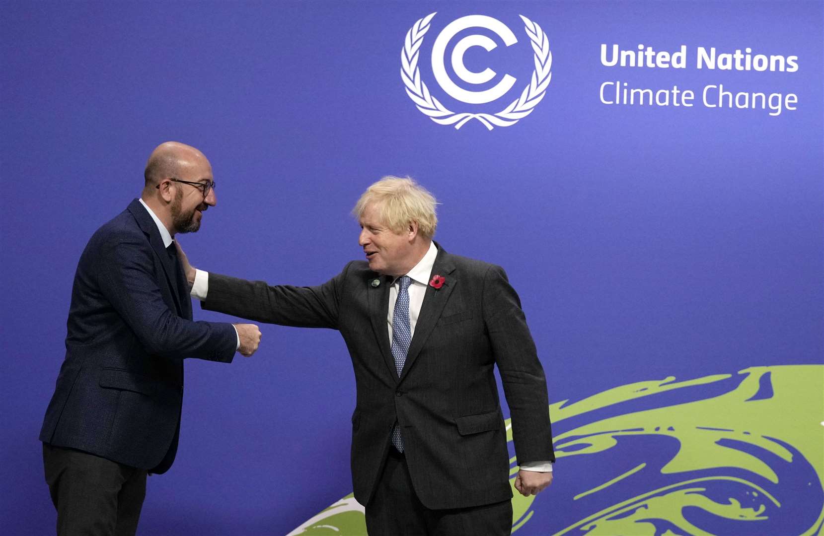 Boris Johnson keeps European Council president Charles Michel at arm’s length during the Cop26 meet-and-greet (Alastair Grant/PA)