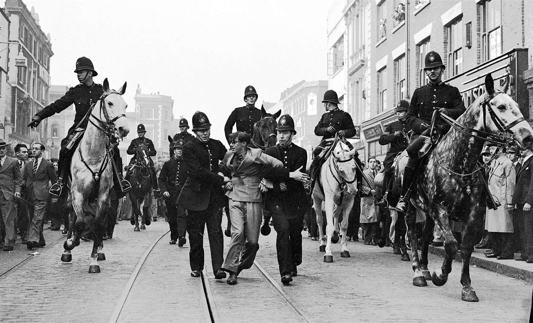 This photo from the Resistance display shows Eddie Worth, an anti-fascist demonstrator, being arrested during the Battle of Cable Street, London, on October 4 1936. Picture: © Alamy