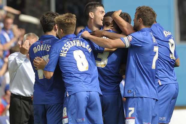 Joe Martin mobbed by his team-mates after scoring Saturday's opener Picture: Barry Goodwin