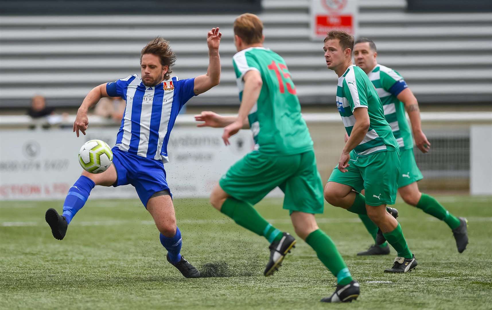 Metrogas Vets (blue) at full stretch against New Ash Green Vets. Picture: PSP Images