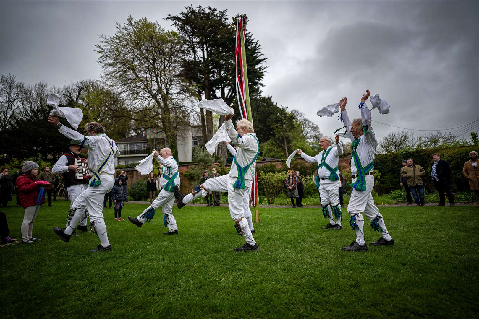 Morris men dance by the maypole at the Chalice Well (Ben Birchall/PA)