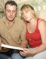 Tony Hood and his sister Jackie with the letter from the hospital. Picture: NICK JOHNSON