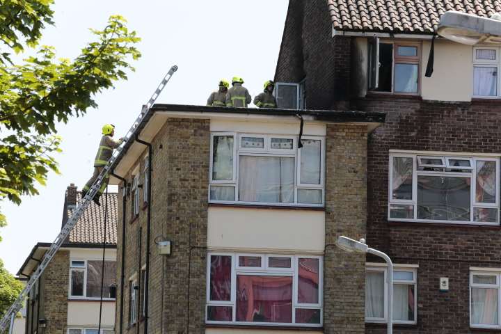 Firefighters on the roof of flats in Park Place, Gravesend. Pic: Martin Apps