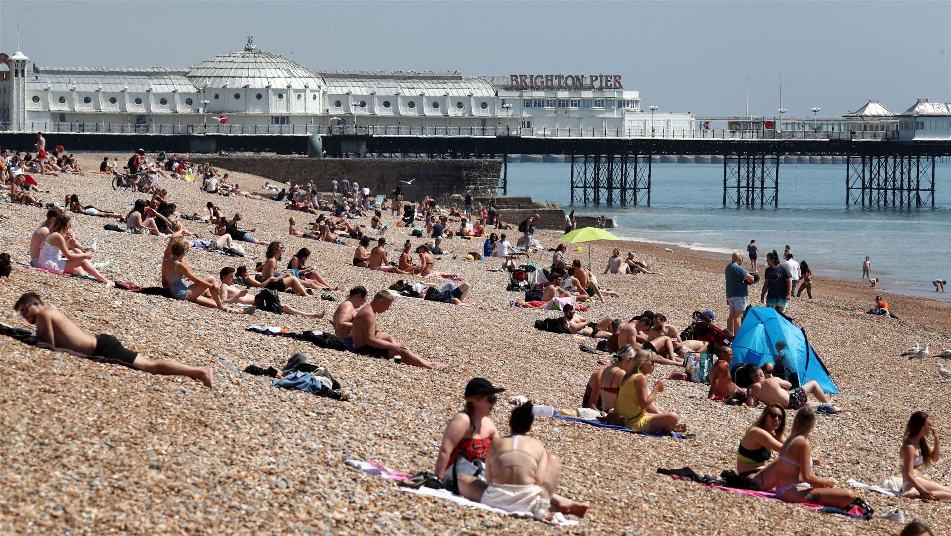 People enjoy the hot weather on Brighton beach on May 21 (Gareth Fuller/PA)