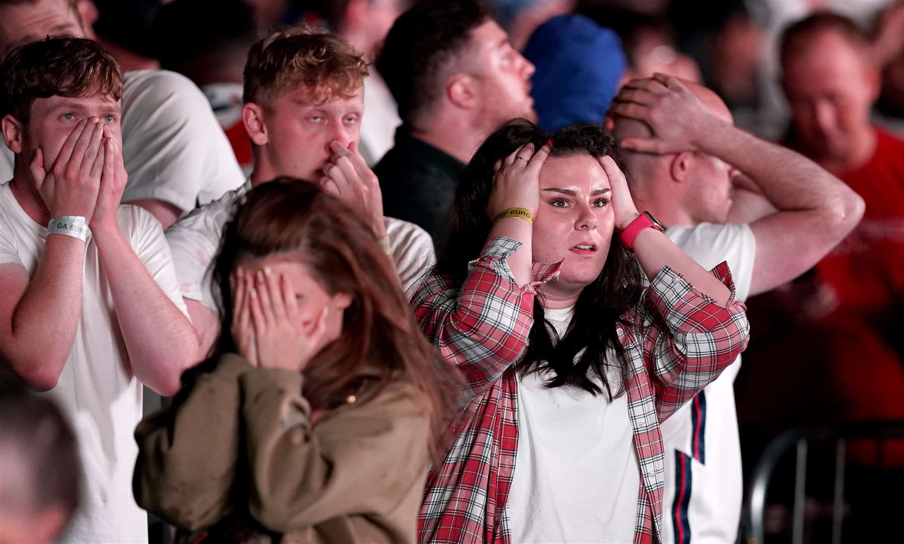 England fans at the fan zone in Trafford Park, Manchester are dejected after England lose (Martin Rickett/PA)