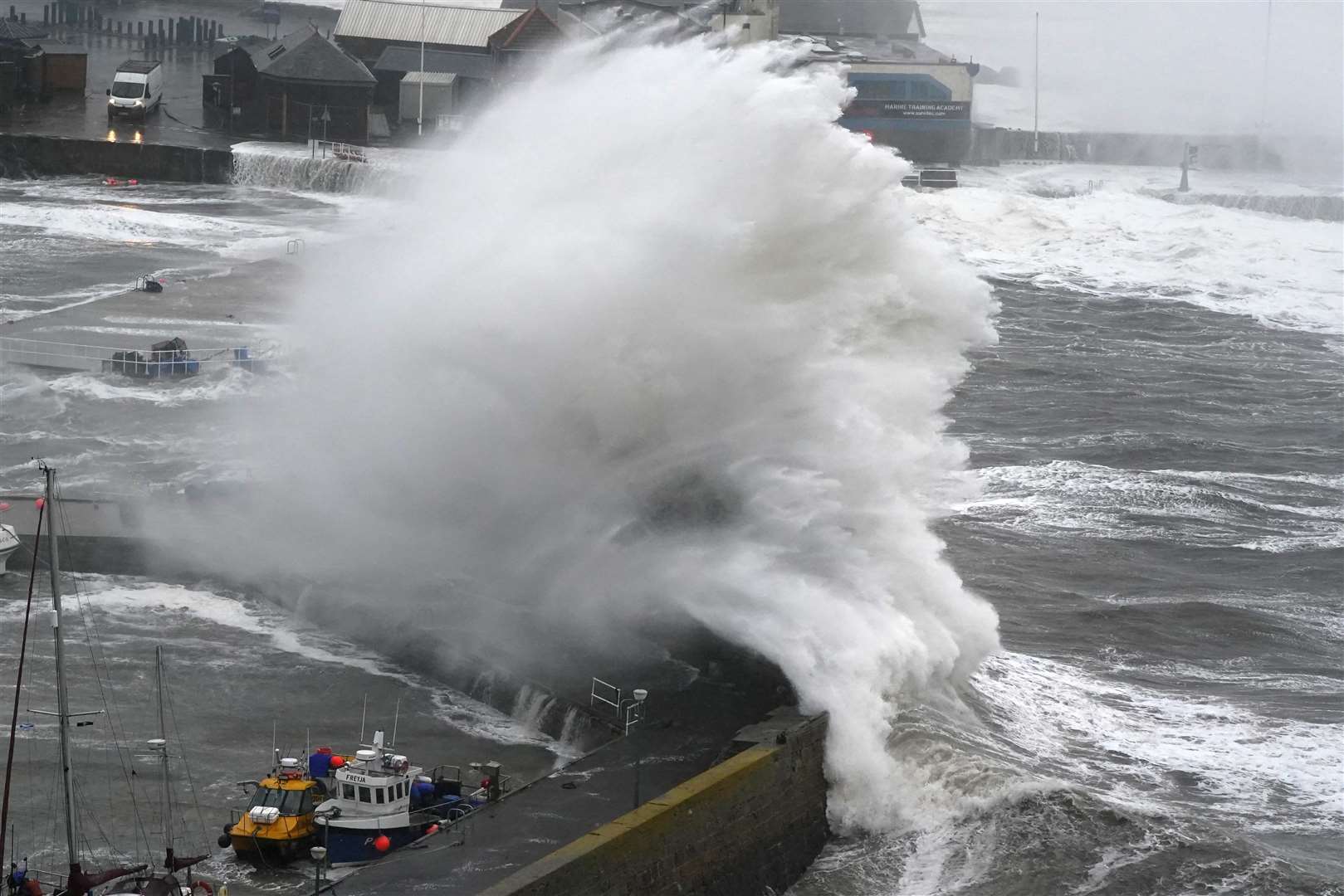 The sheer power of the sea was evident along huge parts of the coastline in October, as Britain was battered by Storm Babet. Here, waves crash over the harbour wall in Stonehaven, Aberdeenshire (Andrew Milligan/PA)