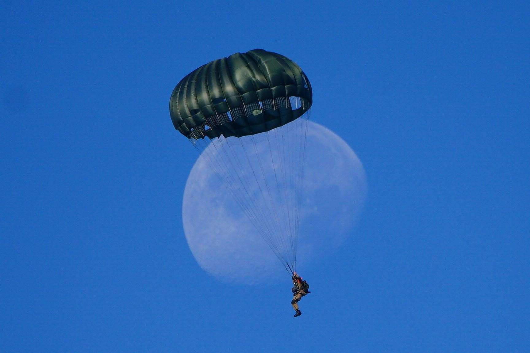 Paratroopers from eight Nato member countries jump onto Ginkel Heath in Ede, Netherlands (Ben Birchall/PA)