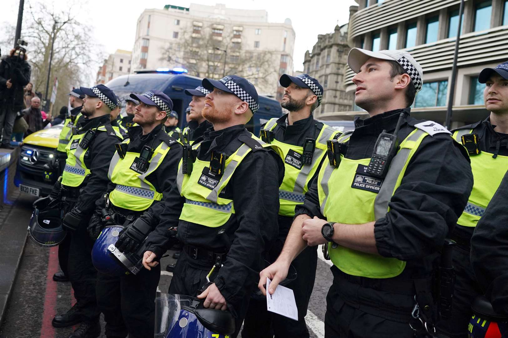 Police watch as people take part in a pro-Palestine march in central London (Jordan Pettitt/PA)